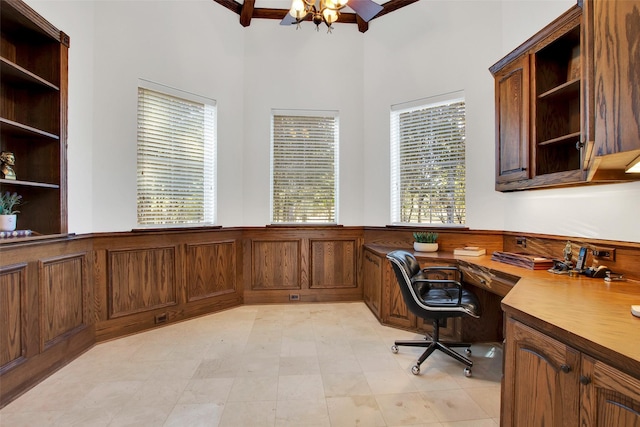 office area with plenty of natural light and an inviting chandelier