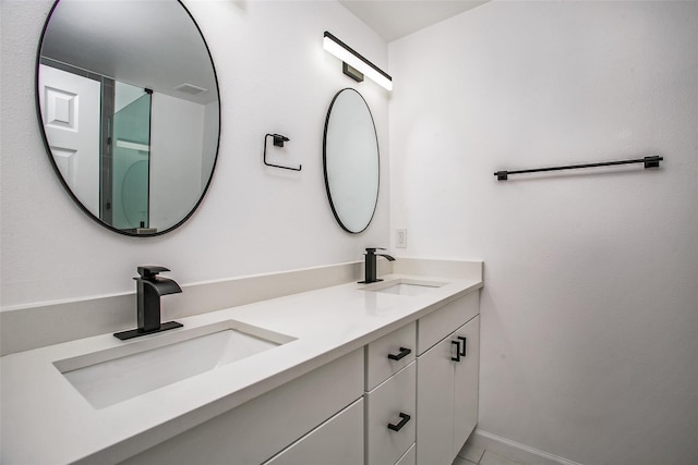 bathroom featuring tile patterned floors and vanity