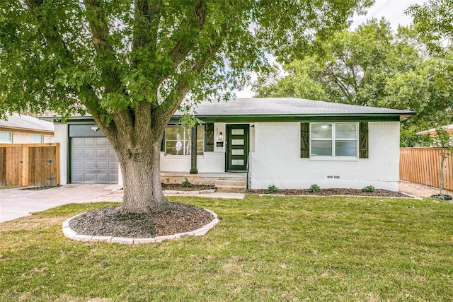 single story home with a garage and a front lawn