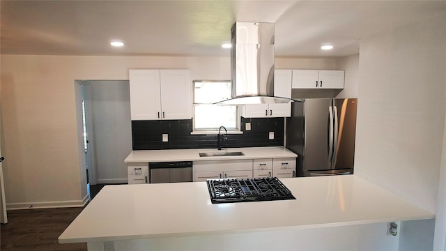 kitchen featuring island range hood, sink, white cabinetry, and stainless steel appliances