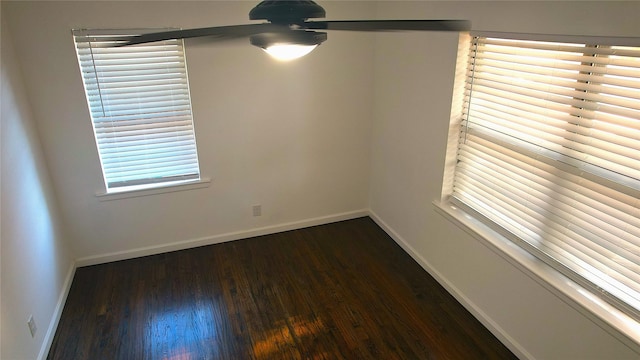 unfurnished room featuring dark hardwood / wood-style flooring and ceiling fan