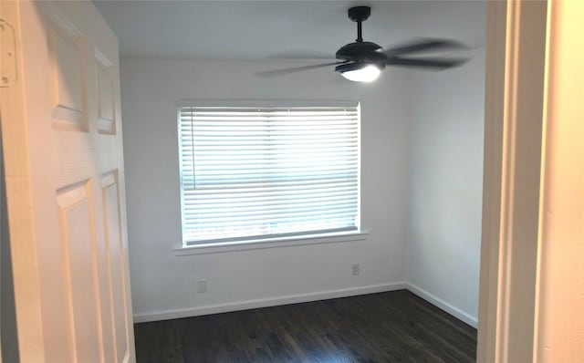 unfurnished room featuring ceiling fan and dark hardwood / wood-style flooring