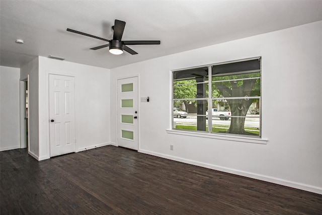 interior space featuring ceiling fan and dark hardwood / wood-style flooring