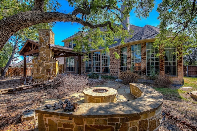 back of house featuring a patio area and an outdoor fire pit