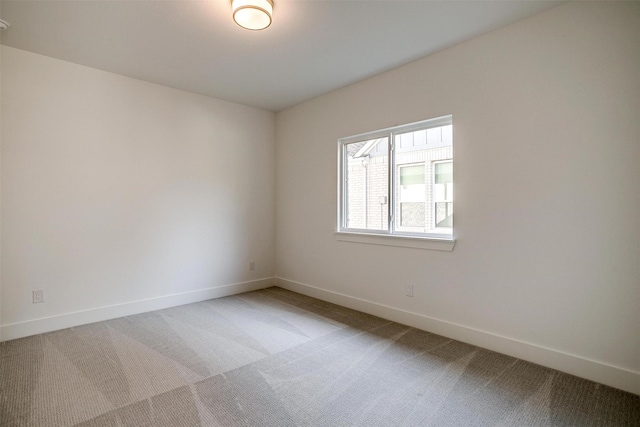 unfurnished room featuring carpet