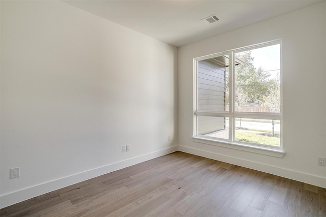 empty room featuring light hardwood / wood-style floors