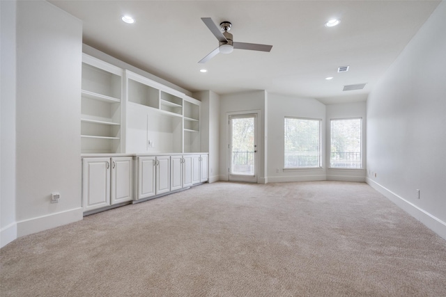 carpeted empty room featuring ceiling fan