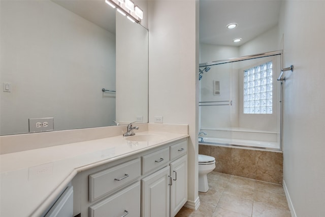 full bathroom with vanity, tile patterned floors, shower / bath combination with glass door, and toilet