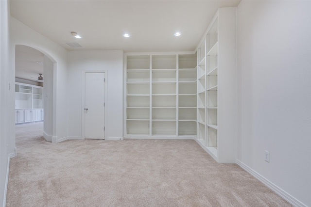 carpeted empty room with ceiling fan