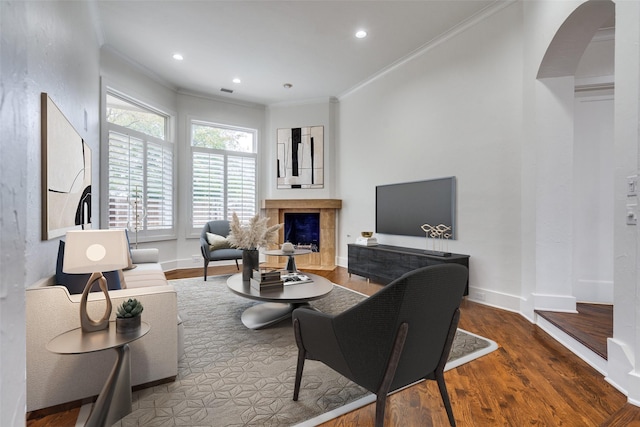 living room featuring ornamental molding and hardwood / wood-style floors