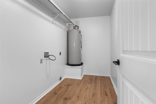 laundry room with hookup for a washing machine, electric water heater, hookup for an electric dryer, and light hardwood / wood-style floors