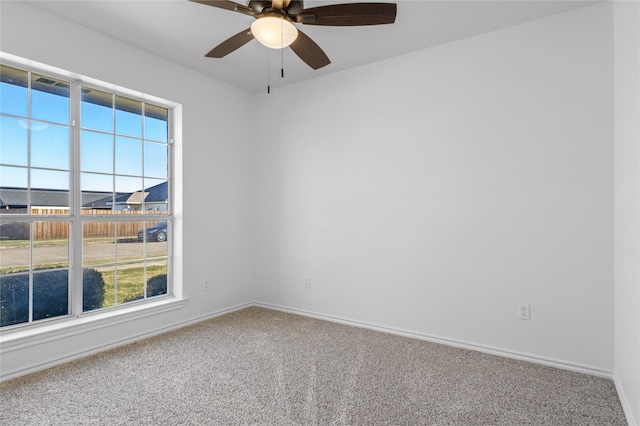 unfurnished room with carpet flooring and ceiling fan