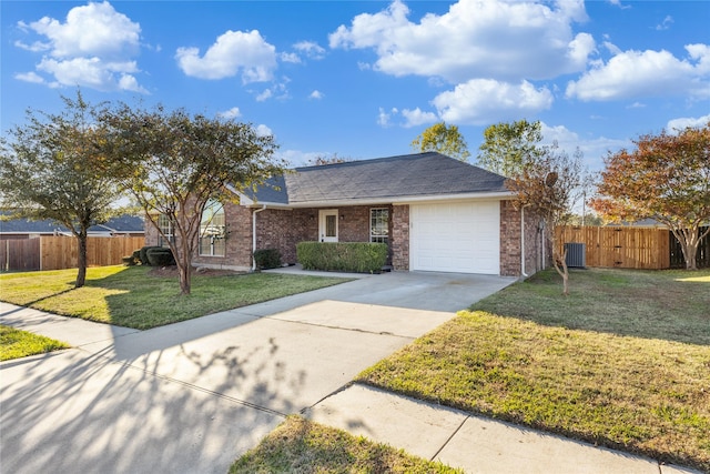 ranch-style house with a garage, a front yard, and central air condition unit