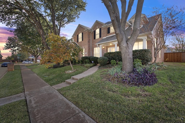 view of front of house featuring a lawn