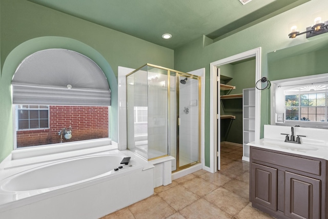 bathroom with vanity, tile patterned floors, and independent shower and bath