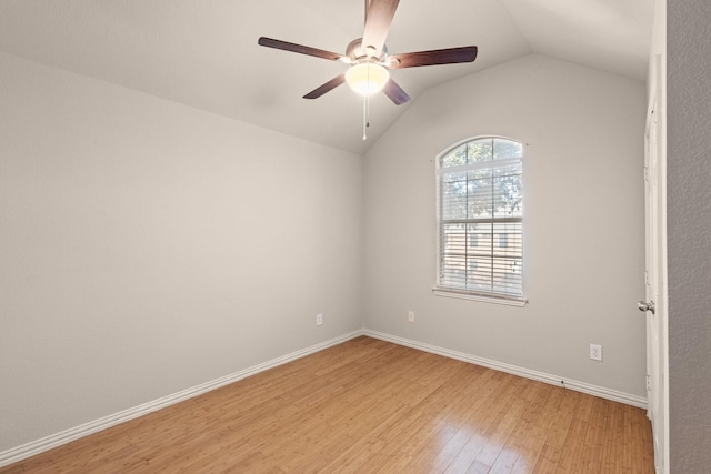 spare room featuring ceiling fan, light hardwood / wood-style flooring, and lofted ceiling