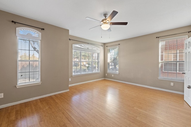 unfurnished room with ceiling fan and light hardwood / wood-style floors