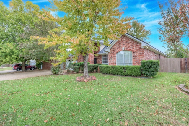 view of front of property with a front lawn