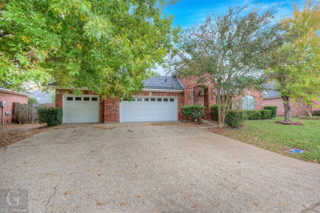 obstructed view of property featuring a garage