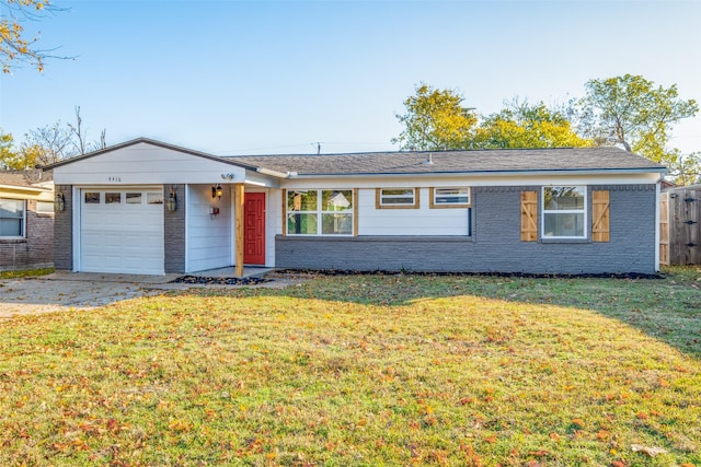 ranch-style home with a garage and a front lawn