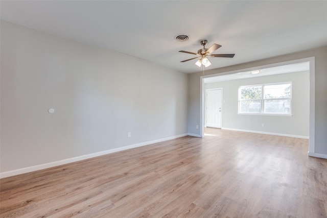 spare room featuring ceiling fan and light hardwood / wood-style floors