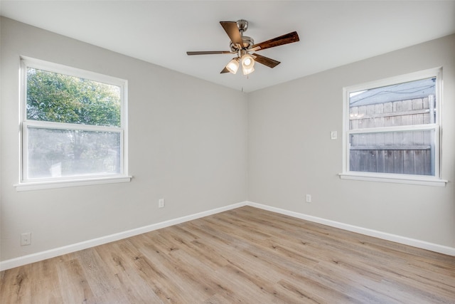 unfurnished room with ceiling fan and light wood-type flooring