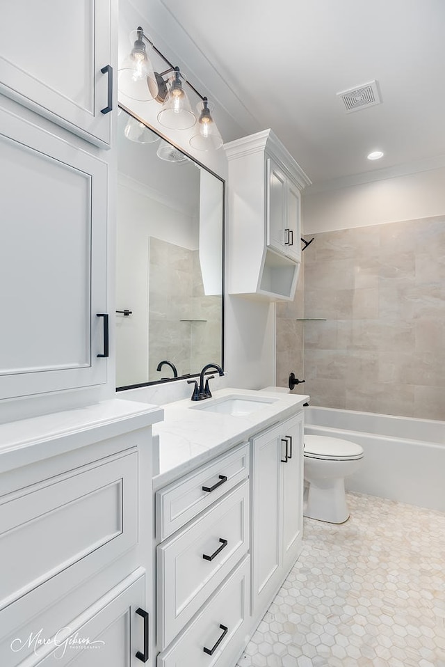 bathroom featuring visible vents, tub / shower combination, crown molding, toilet, and vanity