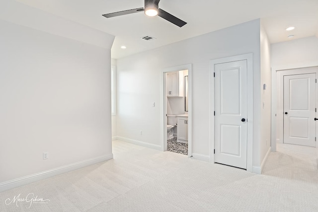 unfurnished bedroom featuring recessed lighting, baseboards, visible vents, and light carpet