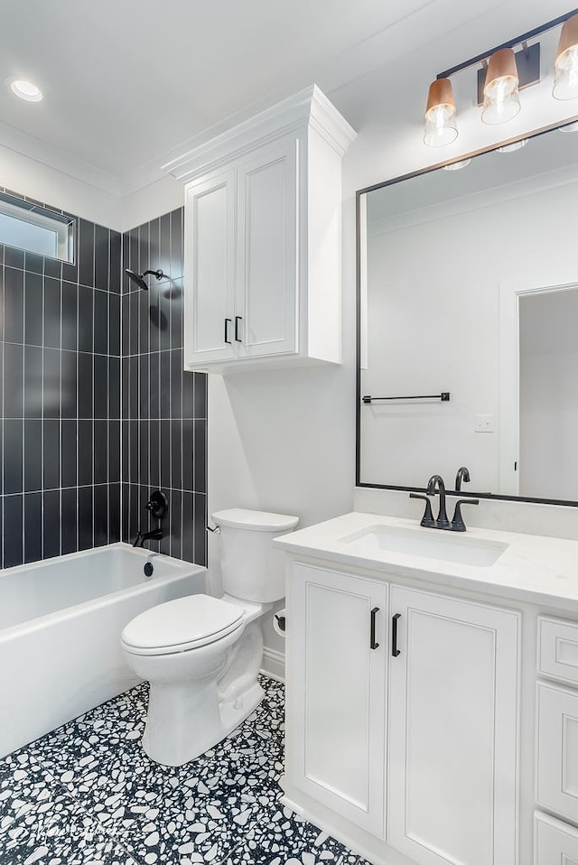 bathroom featuring bathing tub / shower combination, toilet, vanity, and crown molding