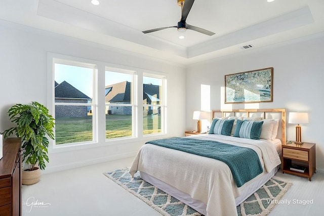 carpeted bedroom with recessed lighting, visible vents, a raised ceiling, and baseboards