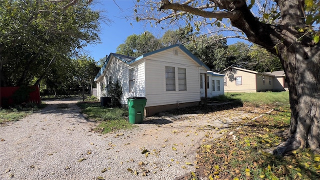 view of side of home featuring central air condition unit