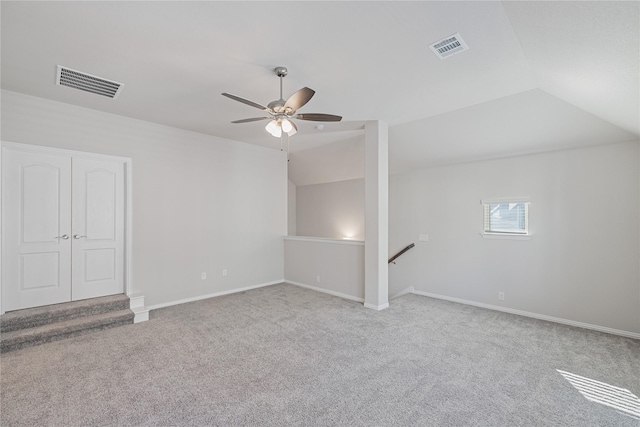 bonus room featuring ceiling fan, vaulted ceiling, and light carpet