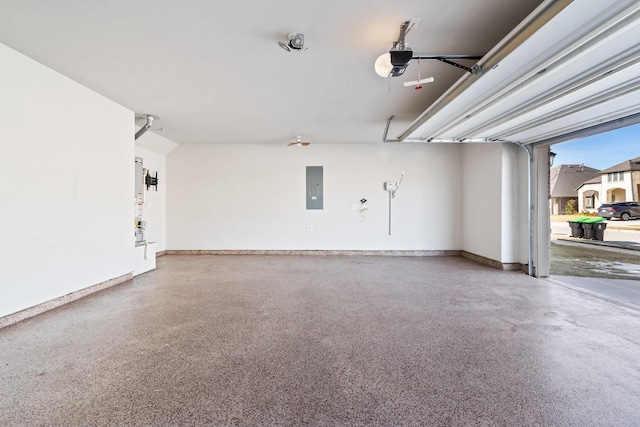 garage with a garage door opener and electric panel