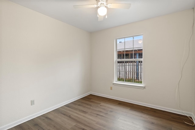 unfurnished room featuring hardwood / wood-style floors and ceiling fan