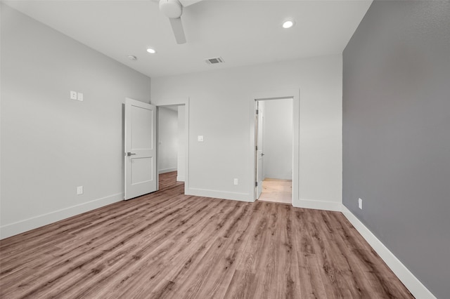 unfurnished bedroom featuring ceiling fan and light hardwood / wood-style flooring