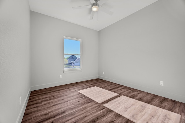 spare room with wood-type flooring and ceiling fan