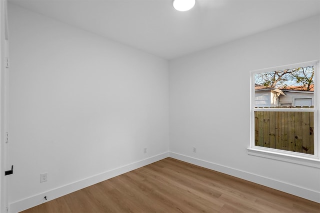 empty room featuring hardwood / wood-style flooring