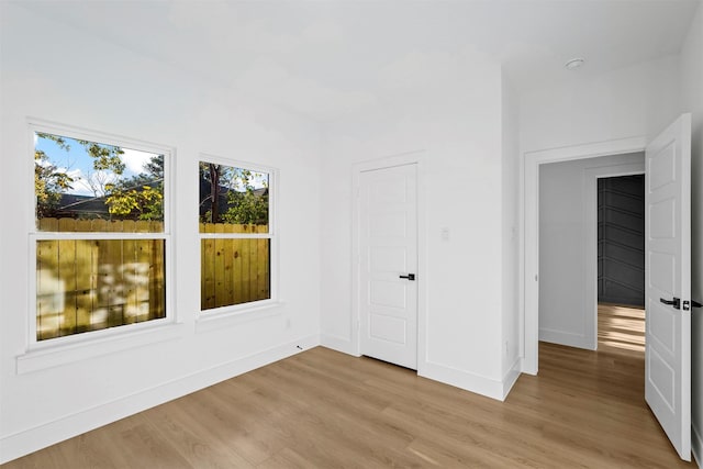 unfurnished room featuring light hardwood / wood-style flooring