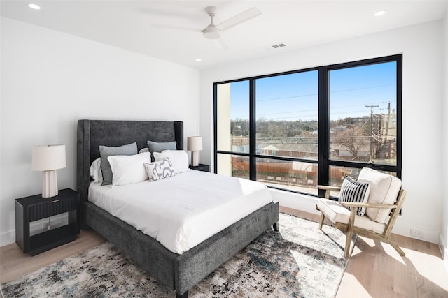 bedroom featuring ceiling fan and light hardwood / wood-style floors