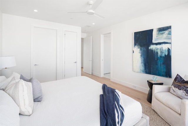 bedroom featuring ceiling fan and light wood-type flooring