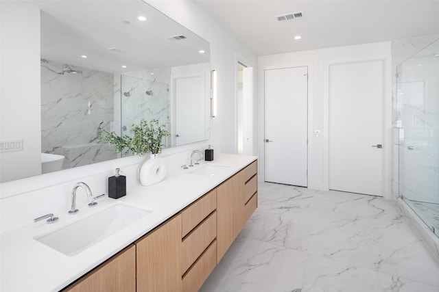 bathroom with an enclosed shower and vanity