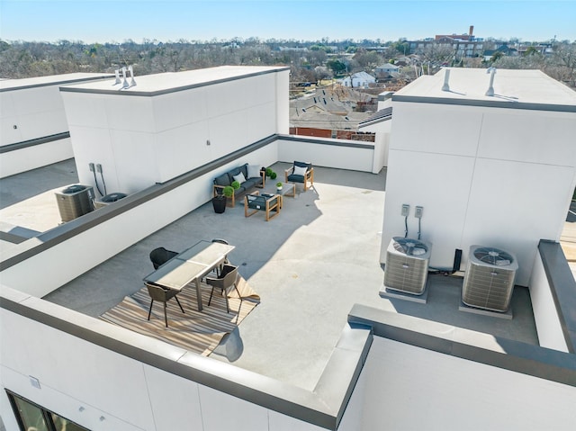 view of patio with cooling unit and a balcony