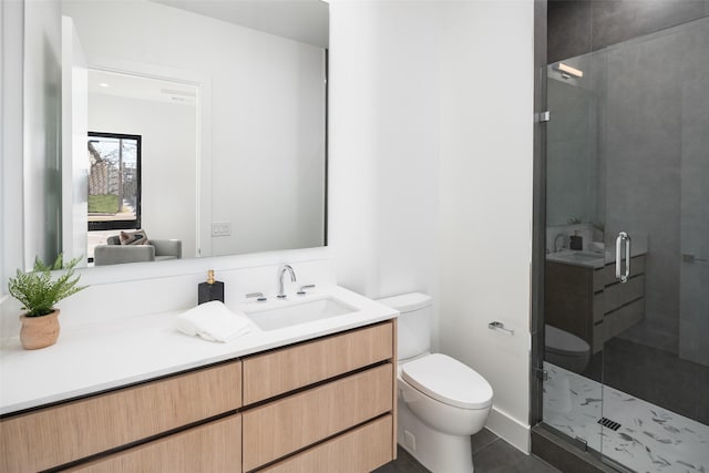 bathroom with a shower with door, toilet, tile patterned flooring, and vanity