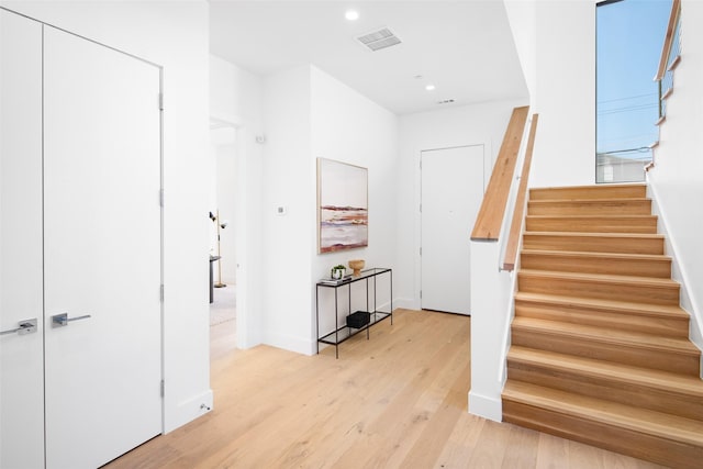 stairway featuring hardwood / wood-style flooring