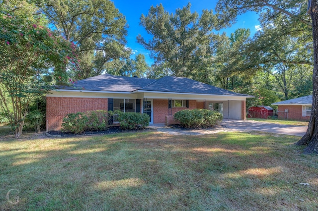 ranch-style house with a carport and a front lawn