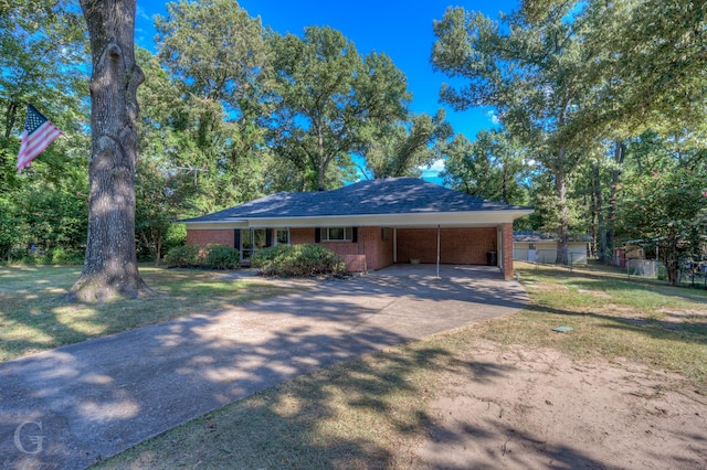 ranch-style house with a front lawn and a carport