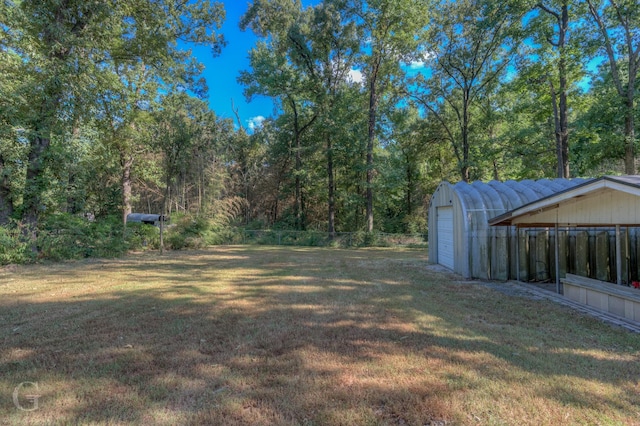 view of yard with an outdoor structure