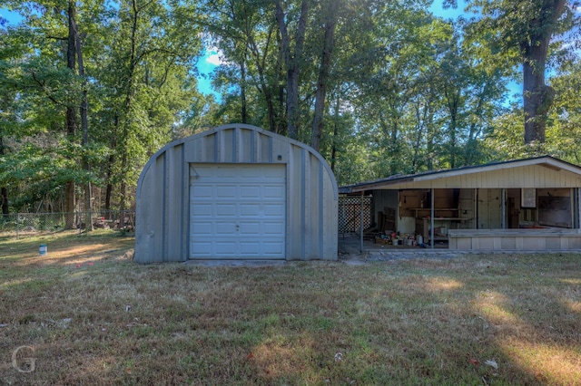 garage with a lawn