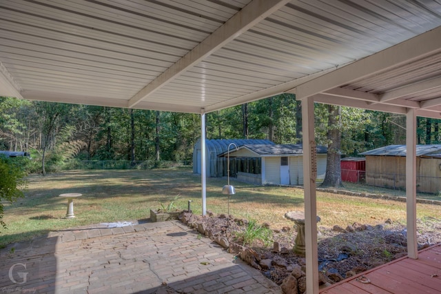 view of patio with a storage shed
