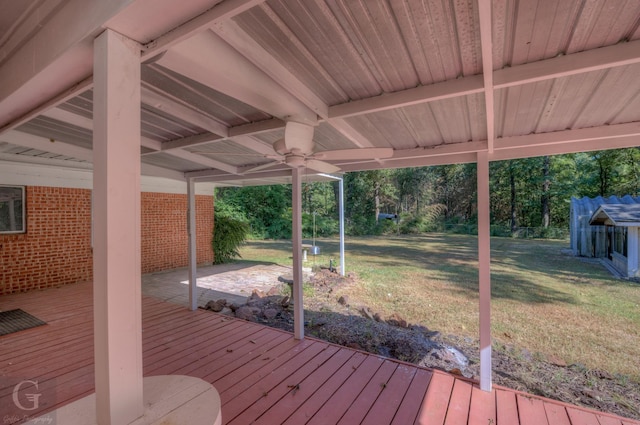 deck featuring a lawn, a patio area, and ceiling fan